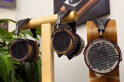 Audeze LCD-2, LCD-3 and LCD-4 headphones hanging on headphone stands.jpg