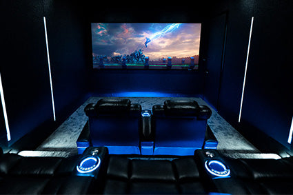 Beautiful 7.2.4 home theater with blue led lighting & Thor movie on the screen