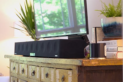 sennheiser ambeo soundbar on top of a piece of furniture under a TV