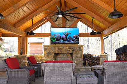 outdoor living room with outdoor tv, outdoor speakers