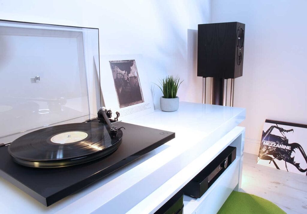 Turntable on top fo a white console table