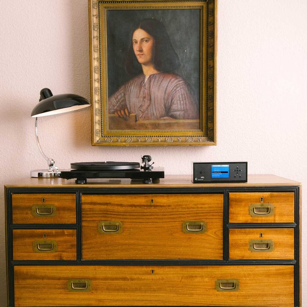 Turntable on top of a wooden dresser