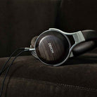 Close-up shot of the Denon AH-D5200 Closed-Back Headphone ear cup.