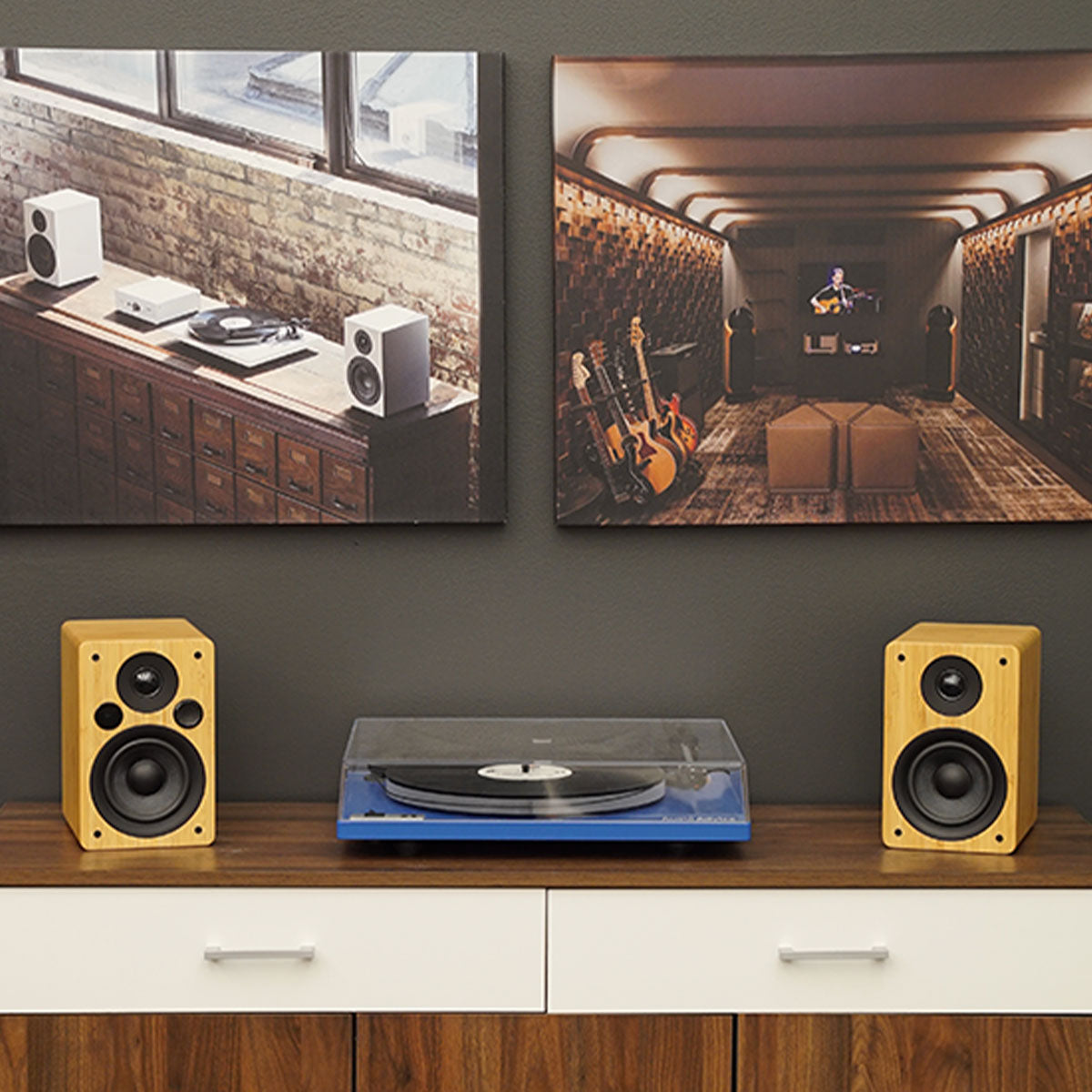 Peachtree M24 Powered Speakers in black set up with a Macbook Pro