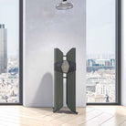 Monitor Audio Hyphn Reference Floorstanding Loudspeaker - front view of matte green speaker in front of window