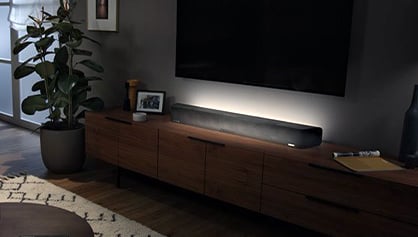 sennheiser ambeo soundbar on a piece of furniture in a room