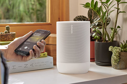 Sonos Move 2 in white with smartphone