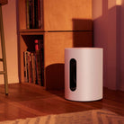 Sonos Sub Mini - White in room by bookshelf