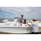 Wide-angle shot of the Soundcast VG5 Portable Waterproof Bluetooth Speaker's being handled on a boat.