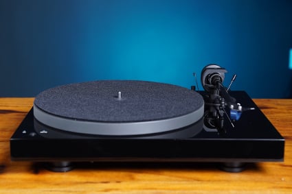 Pro-Ject X1B Turntable in black on a wooden surface